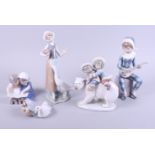 A Lladro figure group of two Inuit children riding a polar bear, 7" high, a similar figure of a