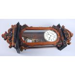 A 19th century walnut Vienna regulator, with enamelled dial, twin winding holes and black painted