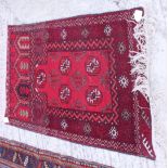 A Bokhara prayer rug with three octagonal guls in traditional shades, 43" x 29" approx