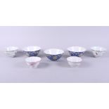 A set of three Chinese porcelain enamelled bowls with flower and Buddhist symbol decoration, six