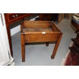 A mid 20th century oak plant stand, on reeded square supports, and an Edwardian mahogany piano stool