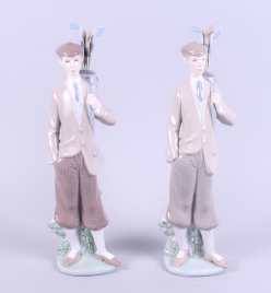 A matched pair of Lladro figures, golfers carrying clubs in bags over shoulder, each 12" high