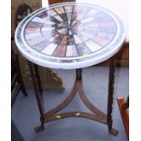 An early 19th century specimen marble table top with twenty-four segments, on later wrought iron