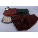 A crocodile skin effect handbag, two other bags and a mink stole