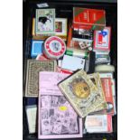A collection of playing cards from around the world and a number of sets of tarot cards