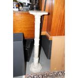 An early 20th century marble jardiniere stand, on octagonal plinth base, 38" high