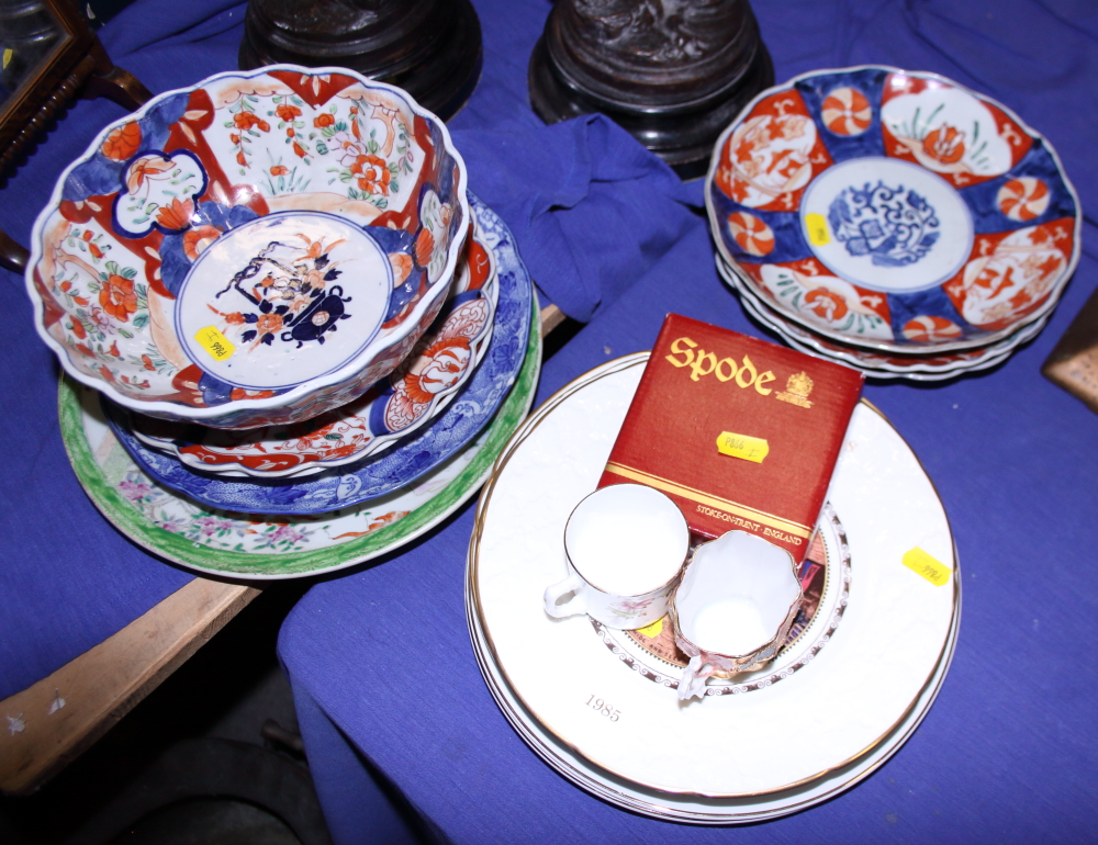 An Imari bowl, 8 1/2" wide, four Imari plates, other decorative plates and two coffee cans