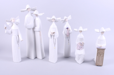 A Lladro figure group of two nuns, 13" high, and five other Lladro figures of nuns in various