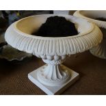 A cast iron shallow garden planter of 18th century design, on square base, 25" dia