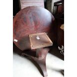 A 19th century mahogany circular table, on central octagonal column, triform platform base and