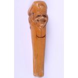 A pair of early 20th century Austrian boxwood nut crackers, in the form of a gentleman's head, 6"