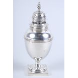 A Gold and Silversmiths George V silver sugar shaker, with ovoid ribbed body, on square base, 7.