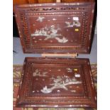 A pair of early 20th century Chinese hardwood trays with applied mother-of-pearl decoration of