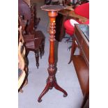 A walnut torchere, on tripod splay support, 10" dia, and a walnut wall cupboard, 17" wide