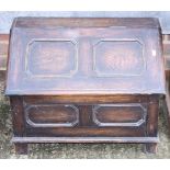 An oak panel front log box, 25" wide and two wall mirrors
