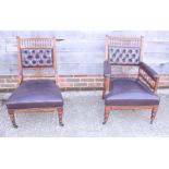 An Edwardian walnut open armchair, button upholstered in a leather, and a companion nursing chair,