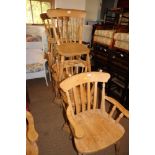A set of eight stripped pine dining chairs with splat back, on turned and stretchered supports (6+2)