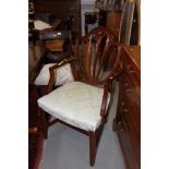 A set of eight Sheraton design polished as mahogany shield-back dining chairs, upholstered in a mint