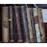 Seven late 19th century leather bound editions of Punch and one other leather bound book