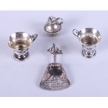 A Dutch silver caddy spoon, decorated boating scenes, import marks Burthold Muller, two miniature