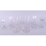 A set of six dwarf ale glasses with engraved decoration and two toasting glasses