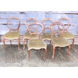 A harlequin set of six Victorian carved walnut dining chairs, on cabriole supports