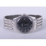 A stainless steel Omega Geneve wristwatch with automatic movement, black dial, baton numerals and