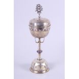 A German Silver Arts & Crafts chalice and cover by A V Mayrhoffer, decorated with swirl motifs and