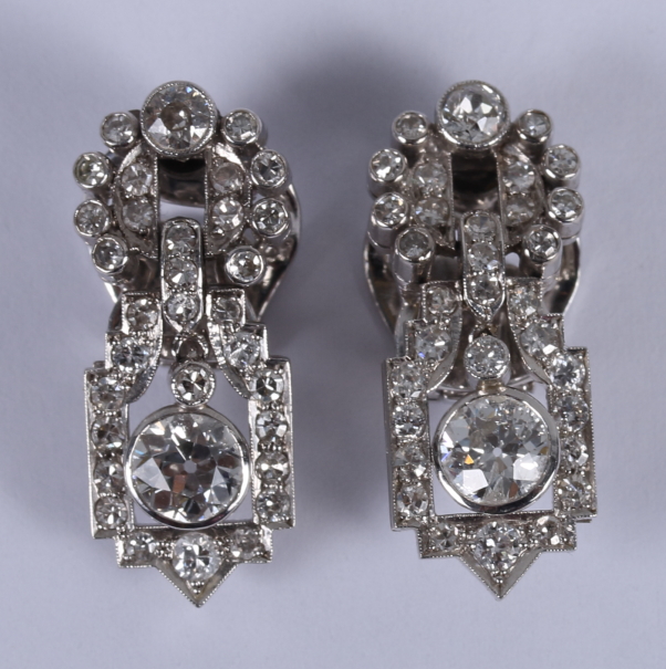 A pair of 18ct white gold Art Deco ear clips, set a combination of old cut, brilliant cut and