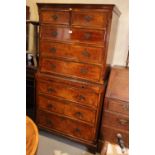 A burr walnut and banded chest on chest with brushing slide, on bracket feet, 35" wide