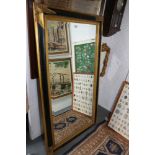 A gilt and ebonised framed bevelled edge wall mirror, plate 23" x 27"
