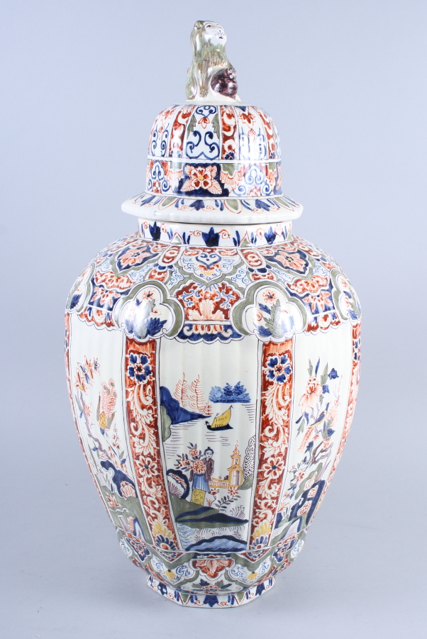 A faience jar and cover with chinoiserie decoration and lion finial, said to be from the estate of