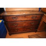 An oak chest of three long drawers with brass bail handles, on bracket feet, 43" wide