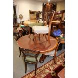 A set of eight late 19th century oval rosewood balloon back standard dining chairs, with stuffed