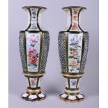 A pair of late 19th century Continental green and white overlaid cut glass vases with floral
