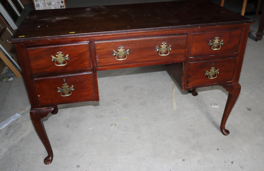 A mahogany writing desk, fitted five drawers, on cabriole supports, 48" wide