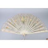 A mid 19th century lace fan with daffodil painted vane and bone sticks, 14" long