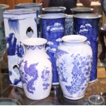 A pair of Chinese porcelain blue and white prunus decorated cylinder vases, 10" high, a floral