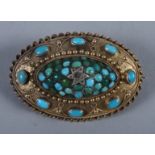 An early Victorian yellow metal Etruscan design oval brooch set with single diamond and turquoise