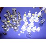 A collection of china, pewter and other glass bells, various