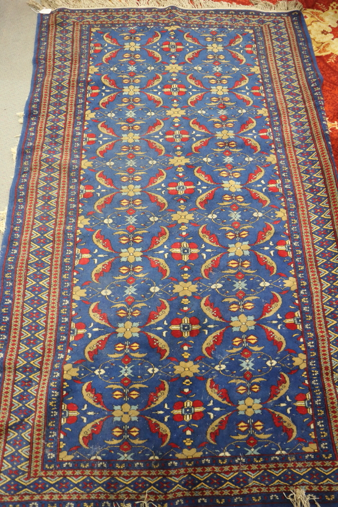 A Herati design rug with all-over pattern on a blue ground, 76" x 49" approx (traces of moth)