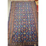 A Herati design rug with all-over pattern on a blue ground, 76" x 49" approx (traces of moth)