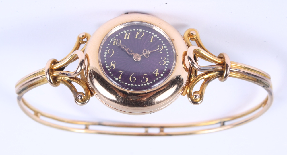 A lady's Le Roy & Fils yellow metal wristwatch, with purple enamelled dial, applied gold numerals