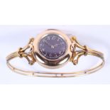 A lady's Le Roy & Fils yellow metal wristwatch, with purple enamelled dial, applied gold numerals