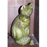 An Ewenny green glazed pottery cat, 15 1/4" high (damaged ear)