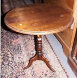 An oak circular top occasional table, on tripod splay support, 24" dia
