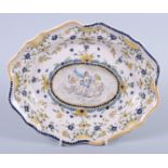 A 19th century faience shaped edge dish with floral and classical figure decoration, 11 1/2" wide