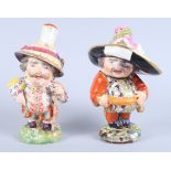 A pair of 19th century Derby porcelain Mansion House Dwarfs, inscribed "N227" to base, 8" high (
