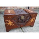 A Chinese carved camphor wood blanket box with figure decoration, 40" wide