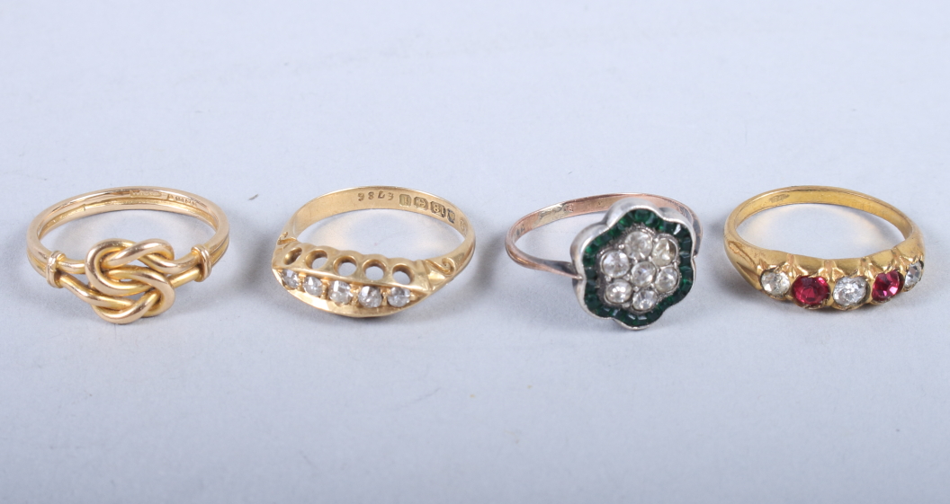 A late 19th century 18ct gold and diamond five stone dress ring, 2.7g, an 18ct gold knot ring, 3g,